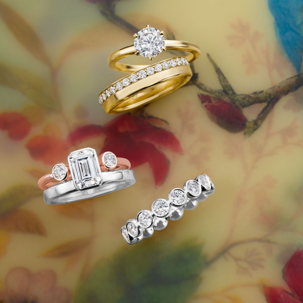 Man made diamond rings by Omi Gold arranged on floral background